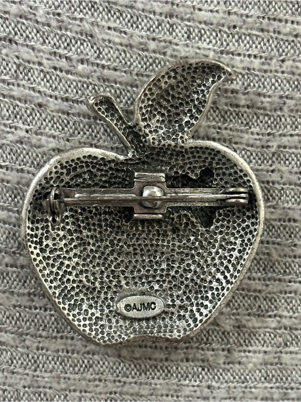 Vintage AJMC marked silver tone American flag apple brooch